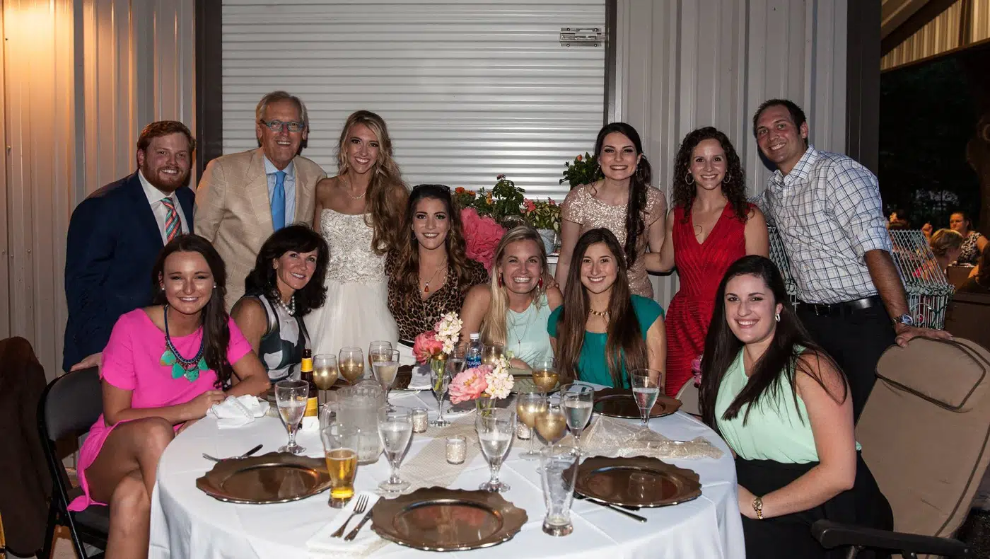 Family photo in front of the dinner table