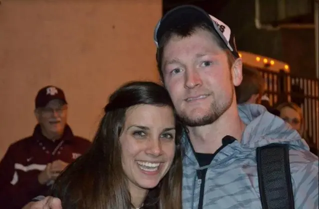 A young couple pose for a photo