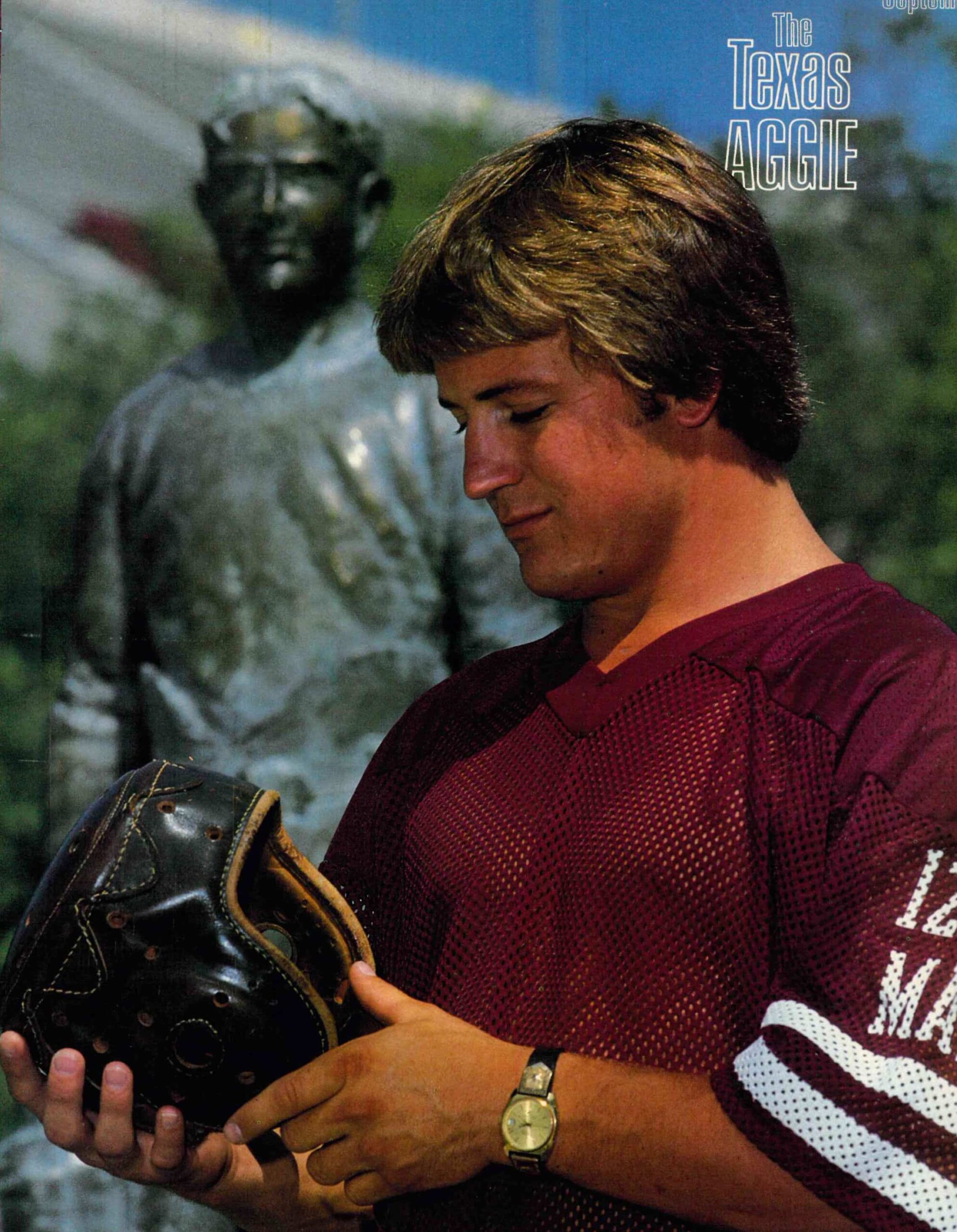 James Barrett holding a football helmet, Texas Aggie issue