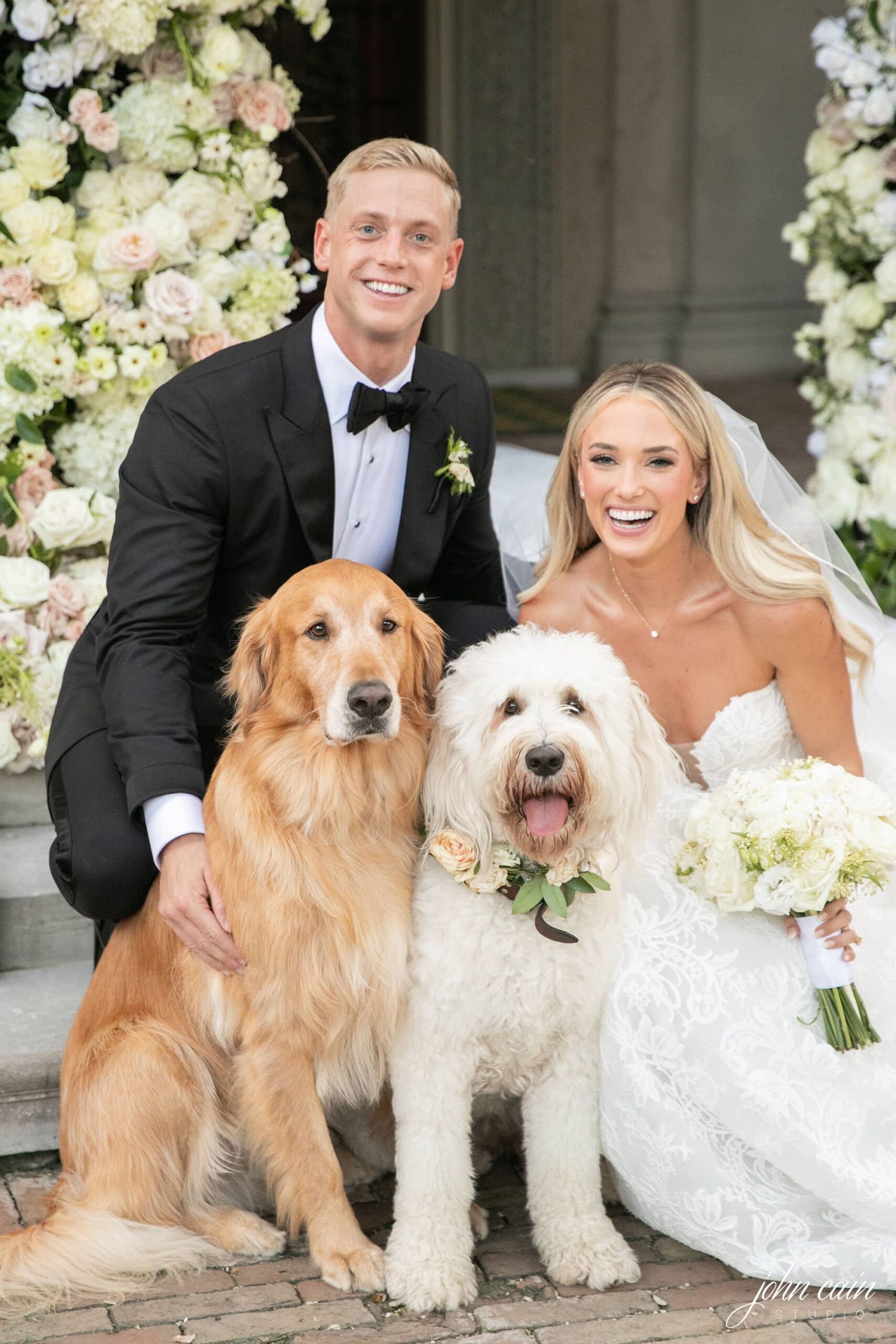 Lee and Emily's wedding photo with their two dogs