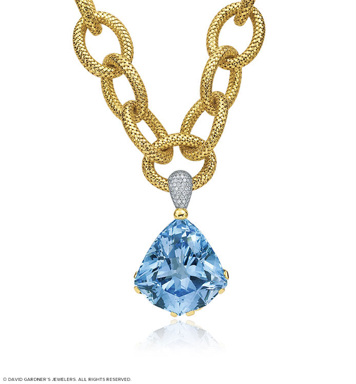 Gold necklace with blue pendant