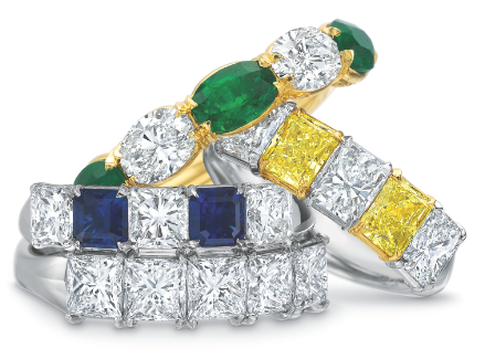 Silver, gold, green and blue rings stacked together