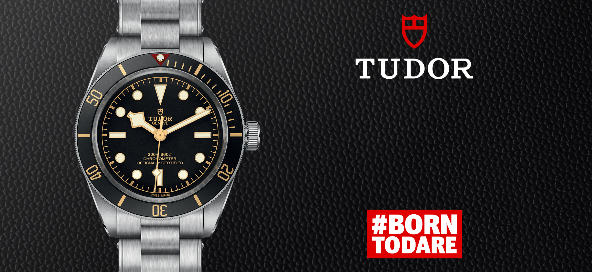 Tudor logo with a watch beside it, #BORNTODARE listed below