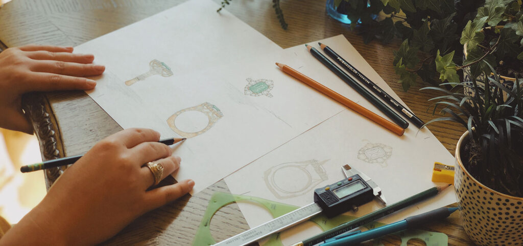 Hand drawing of emerald and diamond ring in gold setting custom designed by David Gardner's in College Station