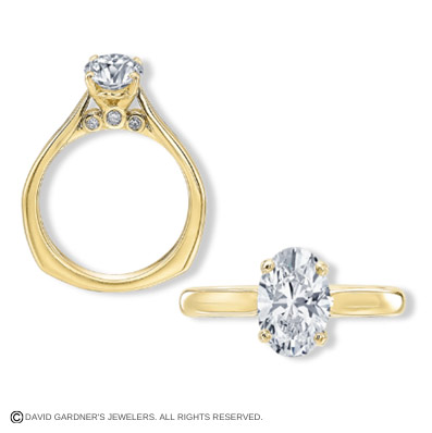 Side and front view of a yellow gold single center diamond engagement ring.
