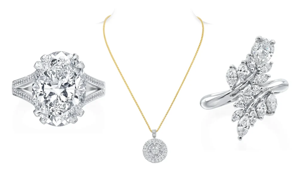 Diamond rings alongside yellow gold chain with diamond pendant