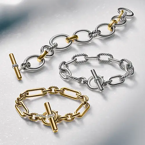 David Yurman chain bracelets in silver and gold.