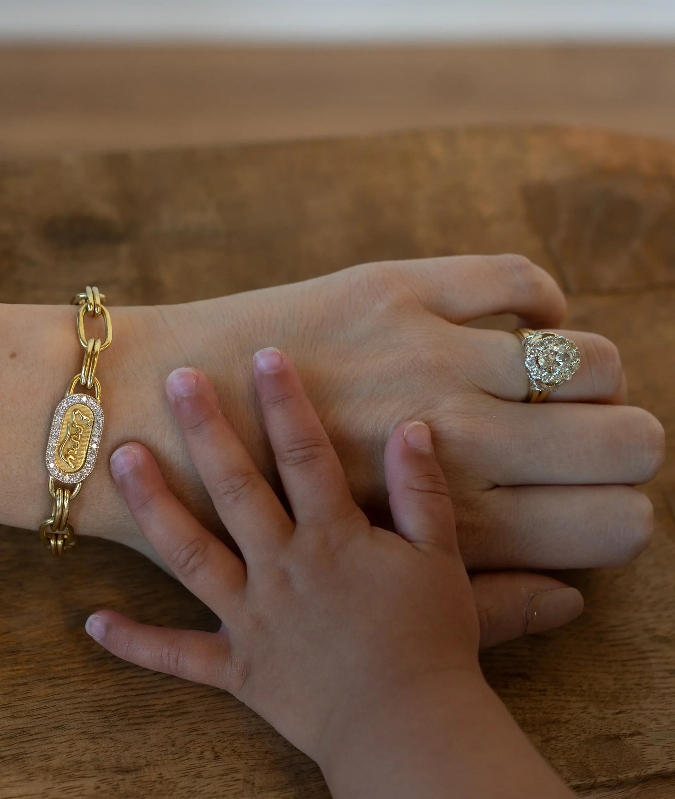 custom jewelry mom and child hands together