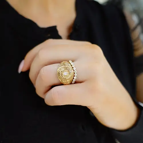 Diamond RingWrap with class ring on woman's finger